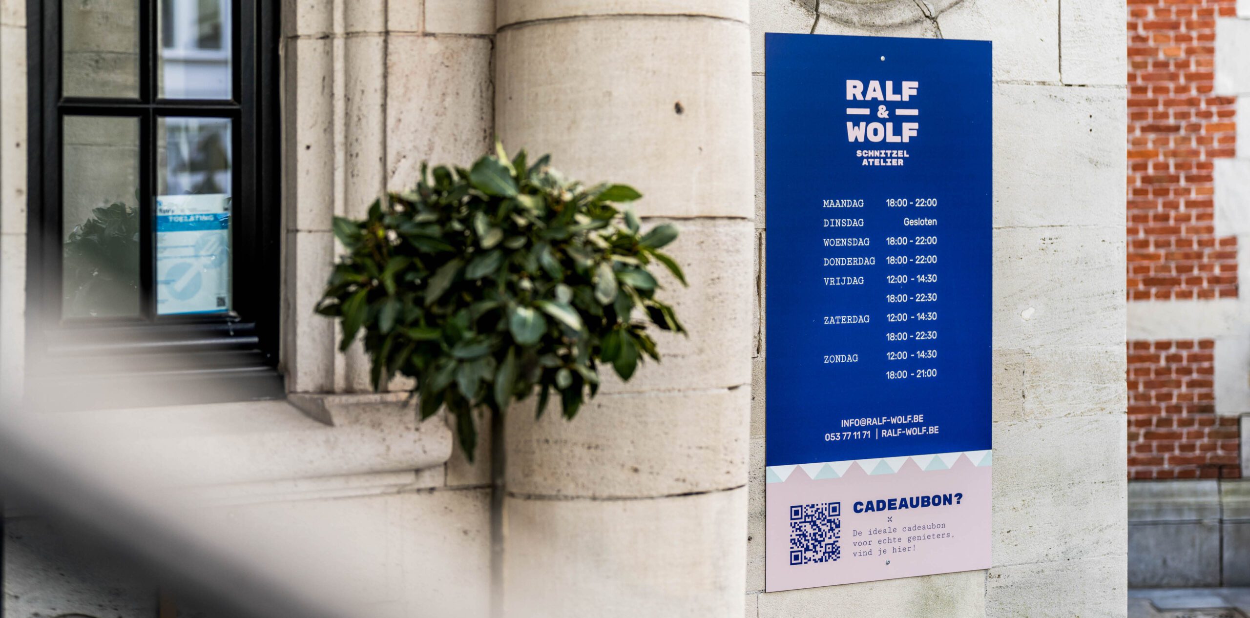Ralf & Wolf menu board on the restaurant facade