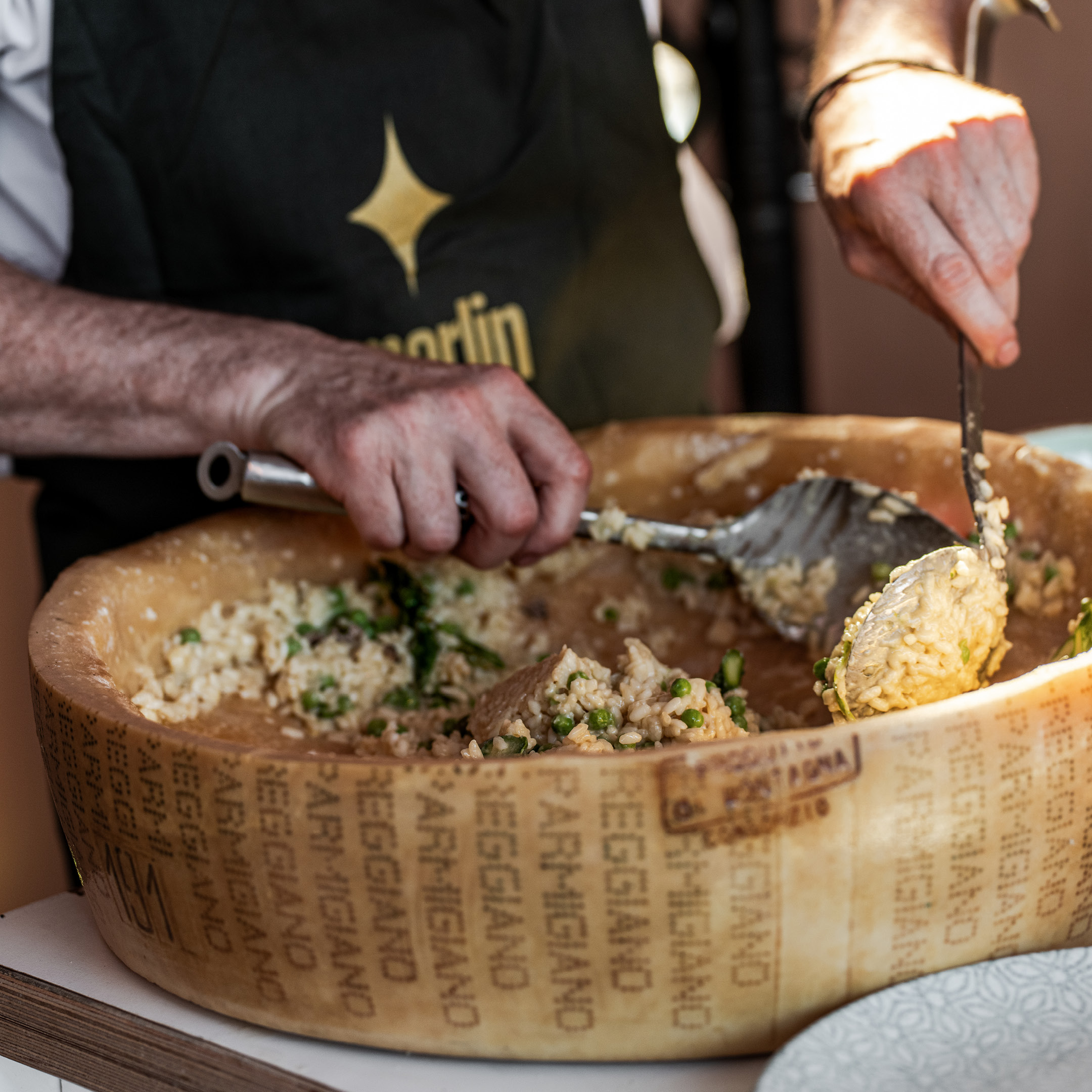 Chef preparing a meal at an &merlin event