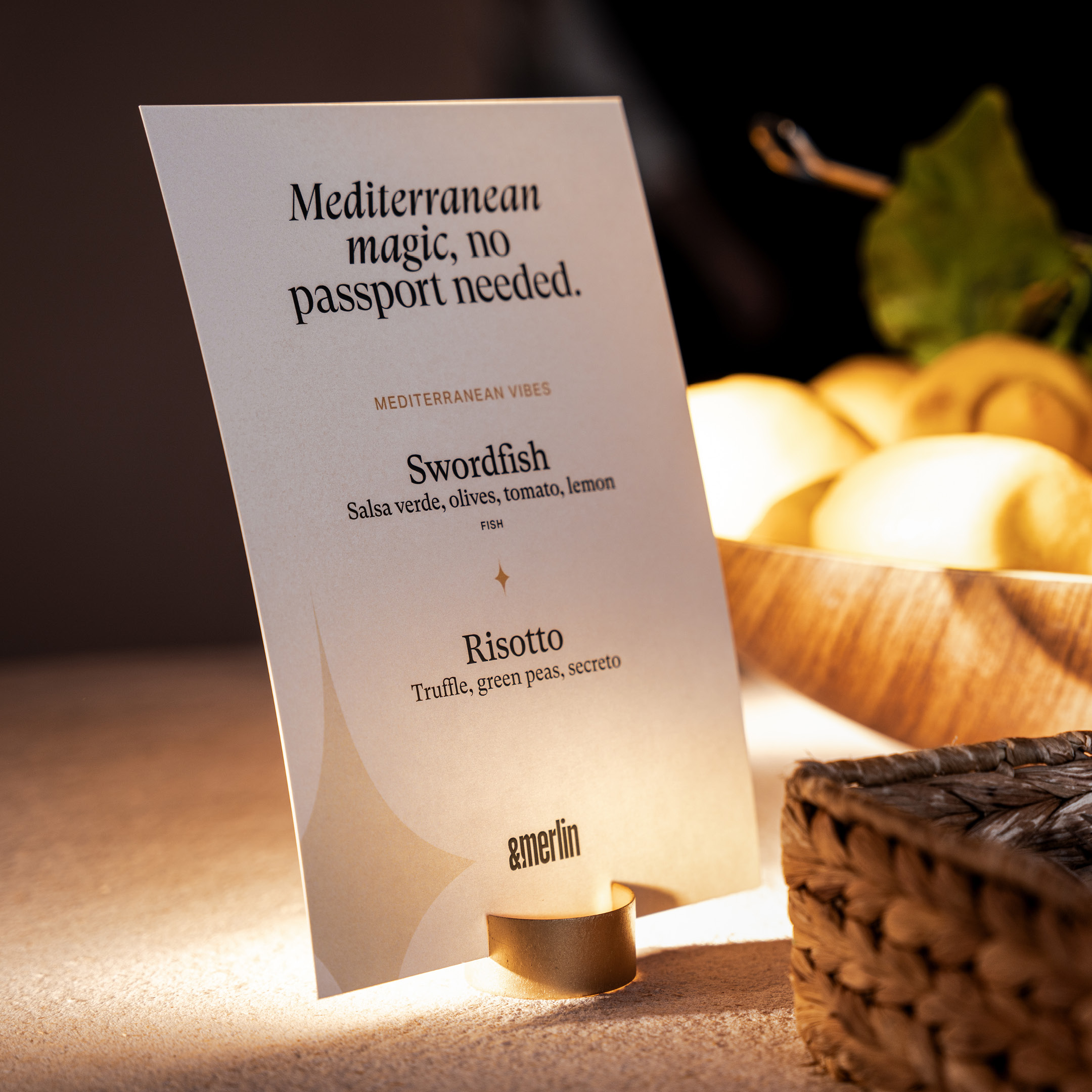 &merlin menu card design on a table