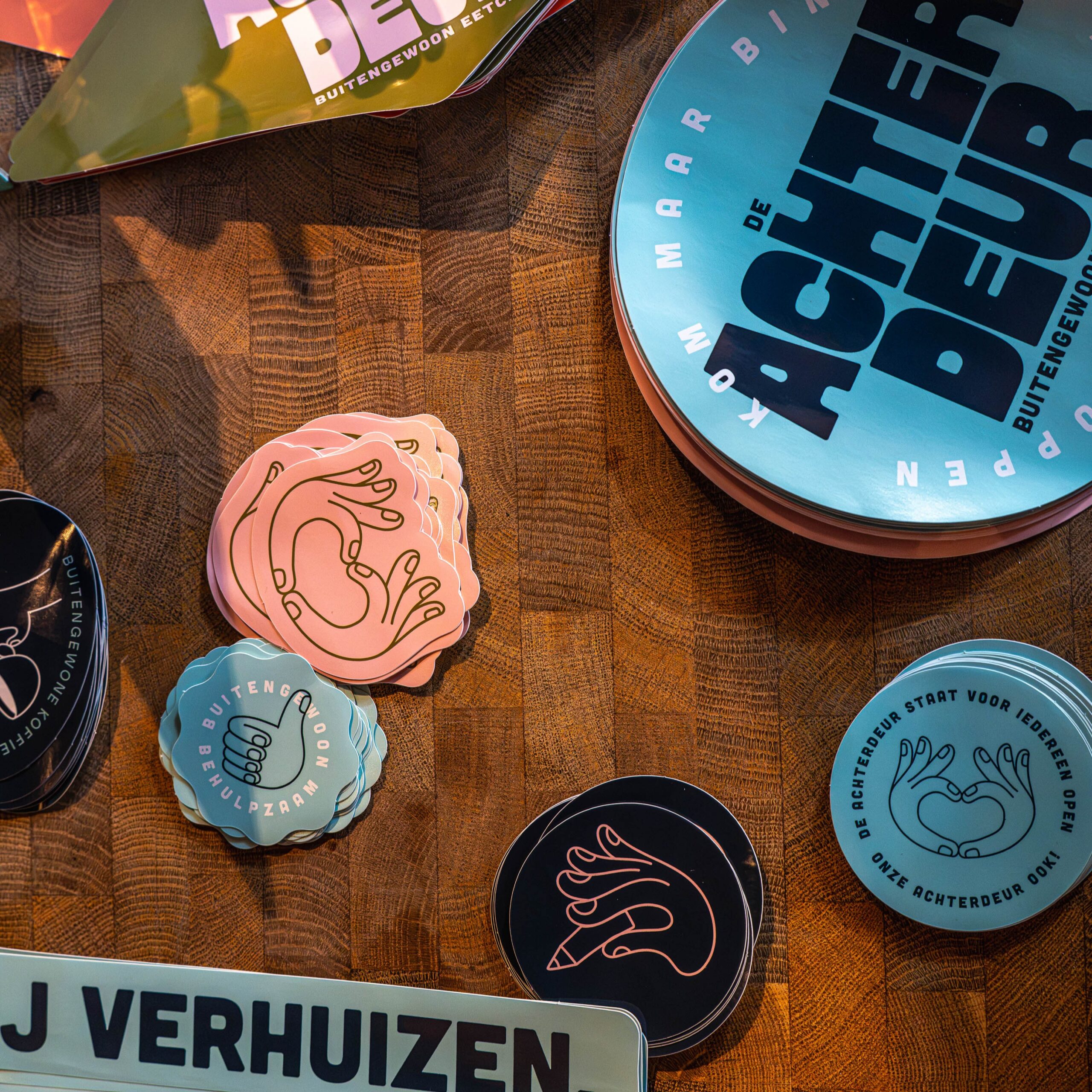 De Achterdeur branded coasters and stickers