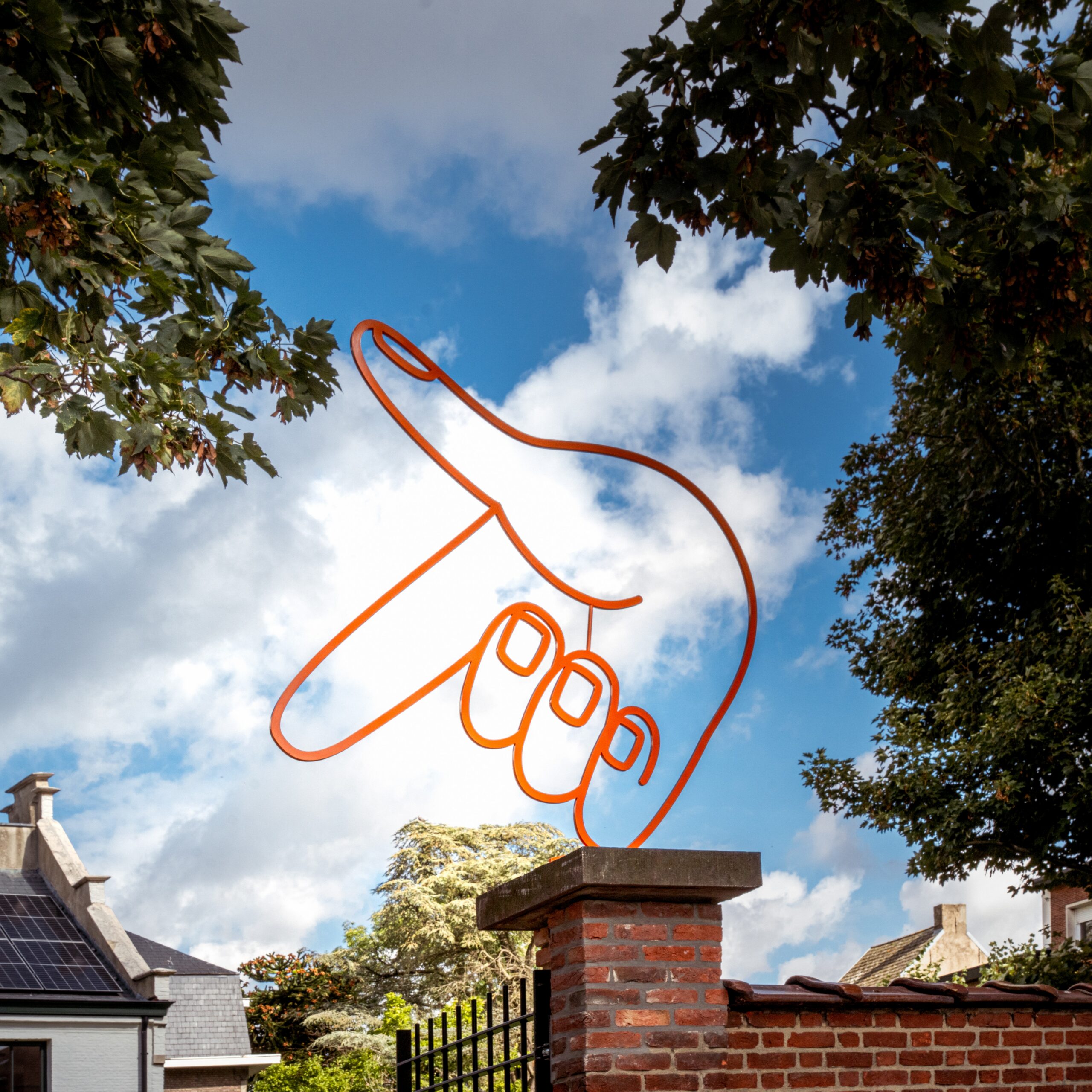 Illustrated hand window graphic at De Achterdeur